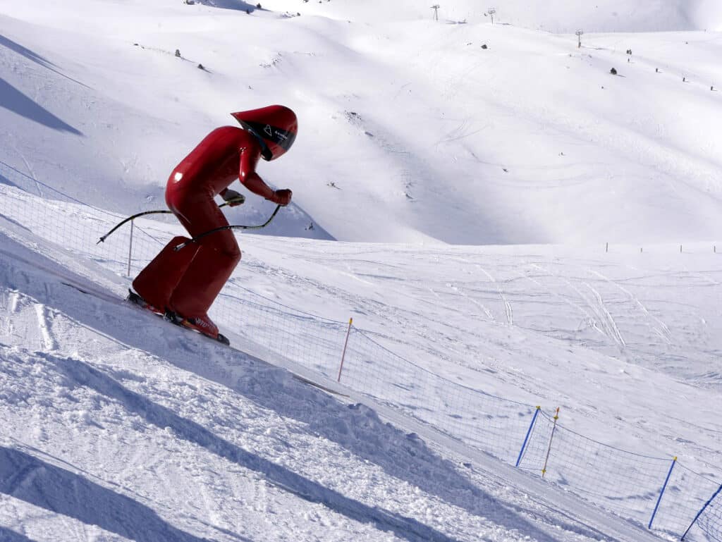 A speed skiier at Grau Roig in a red suit